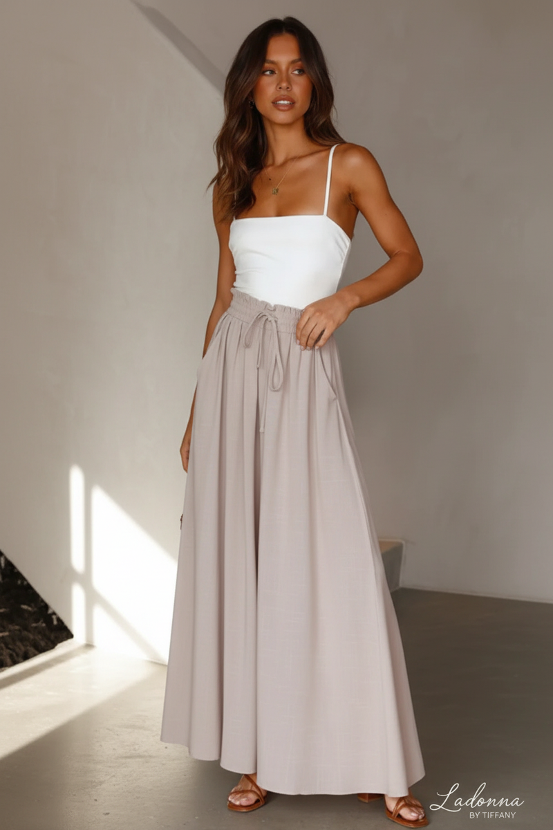 Model in White Top & Gray Skirt